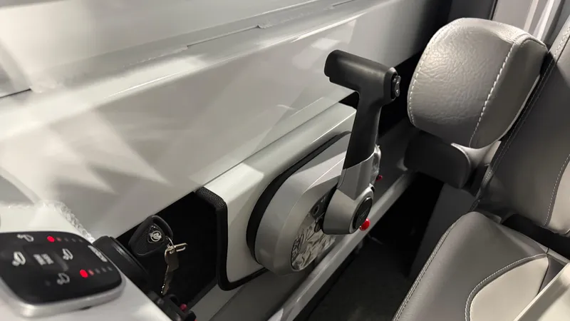 Slide: The Image of Interior of 2025 Hewescraft 240 Ocean Pro ET HT boat, featuring control panel and seat. - 28