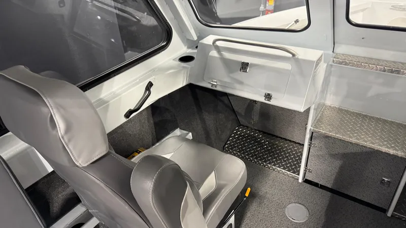 Slide: The Image of 2025 Hewescraft 240 Ocean Pro ET HT interior with seating and storage. - 30