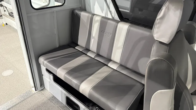 Slide: The Image of 2025 Hewescraft 240 Ocean Pro ET HT interior seating with gray and white upholstery. - 34