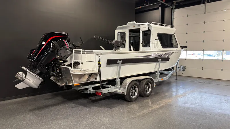 Slide: The Image of 2025 Hewescraft 240 Ocean Pro ET HT boat on trailer in showroom. - 4