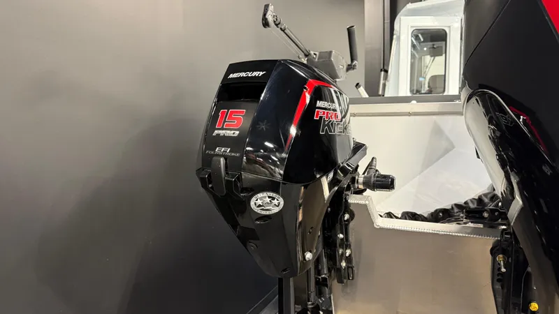 Slide: The Image of 2025 Hewescraft 240 Ocean Pro ET HT with Mercury 15 Pro Kicker outboard motor. - 9