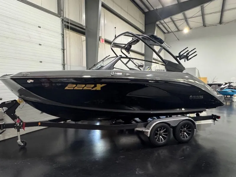 Slide: The Image of 2025 Yamaha Boats 222XD on trailer in indoor showroom. - 1