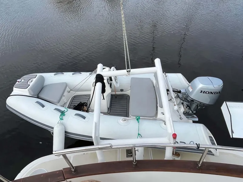 Slide: The Image of Inflatable boat with Honda motor on 2004 Selene Trawler. - 33