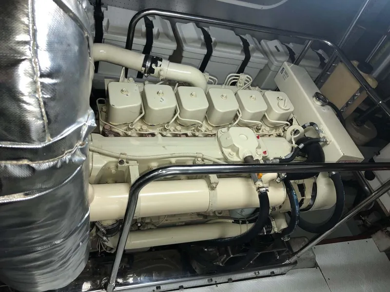 Slide: The Image of Engine room of a 2004 Selene Trawler, showcasing a well-maintained marine engine. - 36