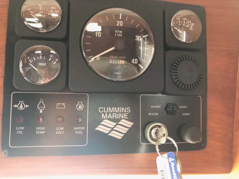 Slide: The Image of Control panel of a 2004 Selene Trawler with Cummins Marine engine gauges and ignition keys. - 7
