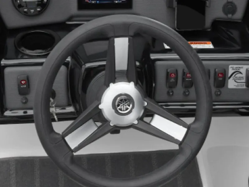 Slide: The Image of Steering wheel of 2025 Yamaha Boats SX190, featuring control panel and switches. - 5
