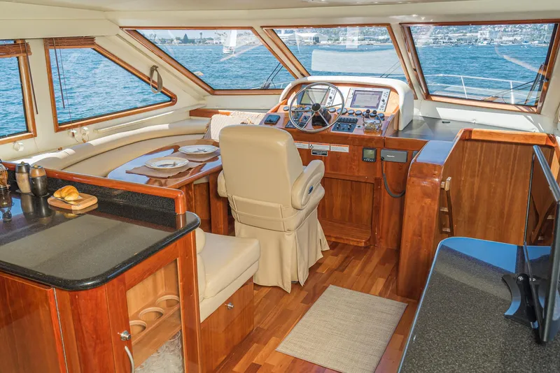 Slide: The Image of Luxurious 2008 Navigator 62 Pilothouse interior with elegant wood finish and panoramic windows. - 37
