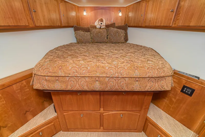 Slide: The Image of Luxurious bedroom in 2008 Navigator 62 Pilothouse yacht with elegant bedding and wood cabinetry. - 50