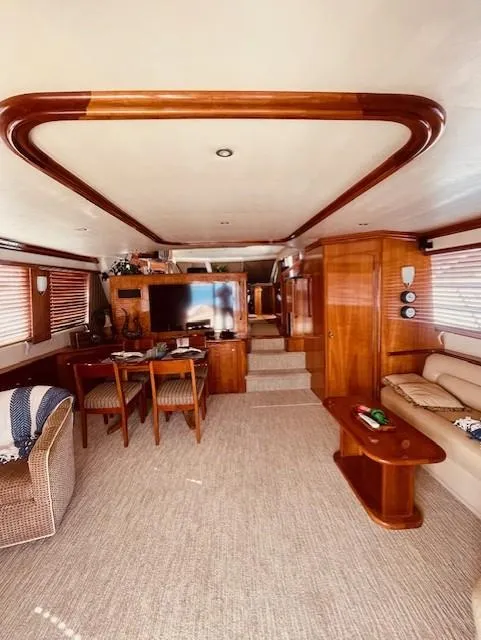 Slide: The Image of Luxurious 2008 Navigator 62 Pilothouse interior with elegant wood finishes and cozy seating. - 7