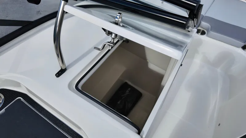 Slide: The Image of 2025 Bayliner VR6 boat storage compartment with open hatch and visible interior. - 17