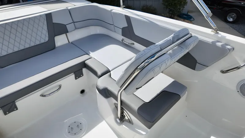 Slide: The Image of 2025 Bayliner VR6 boat interior with modern seating and sleek design. - 21