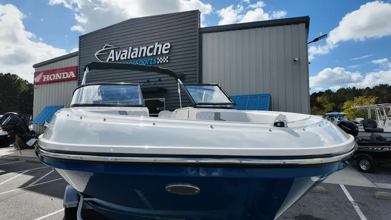 Slide: The Image of 2025 Bayliner VR6 boat displayed at Avalanche Motorsports dealership. - 4