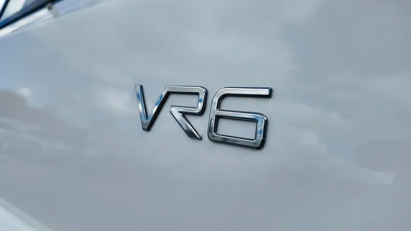 Slide: The Image of 2025 Bayliner VR6 logo on sleek boat exterior. - 9