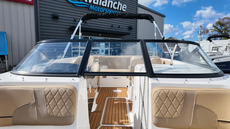 Slide: The Image of 2025 Bayliner VR6 boat with tan interior at Avalanche Motorsports dealership. - 12