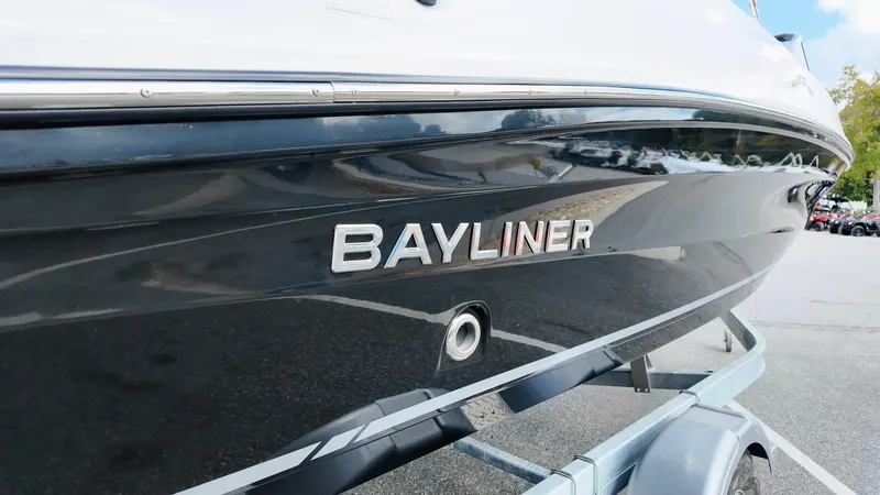 Slide: The Image of 2025 Bayliner VR6 boat on trailer, side view with logo visible. - 4