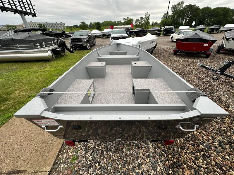 Slide: The Image of 2025 Alumacraft V14 boat on display in outdoor showroom. - 5