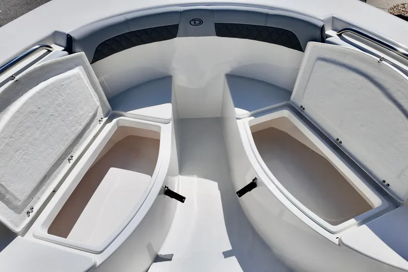 Slide: The Image of 2025 Defiance 240 Catalina boat with open storage compartments on deck. - 13