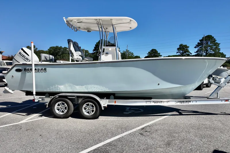 Slide: The Image of 2025 Defiance 240 Catalina boat on trailer, parked in sunny lot. - 16