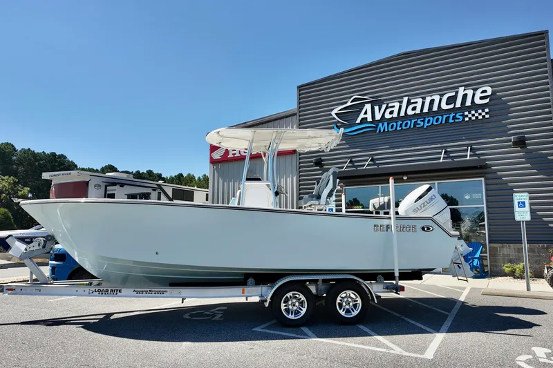 The Image of 2025 Defiance 240 Catalina boat on trailer at Avalanche Motorsports dealership. - 2