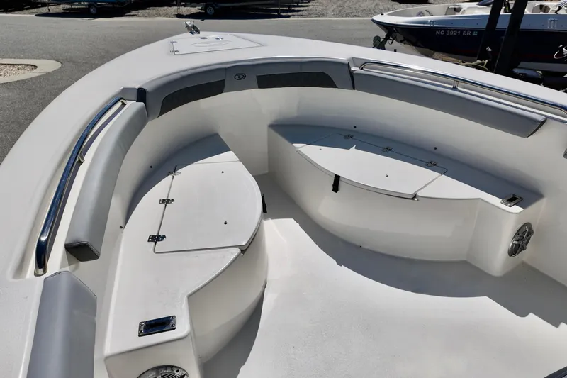 Slide: The Image of 2025 Defiance 240 Catalina boat interior with seating and storage compartments. - 14