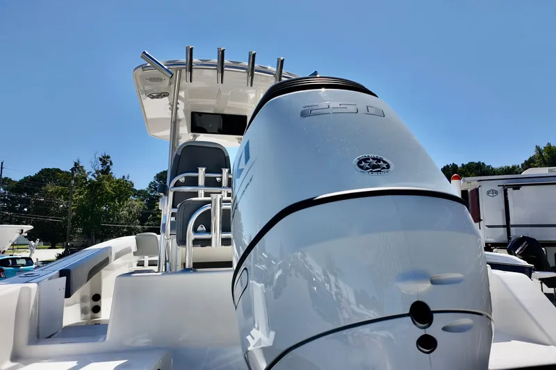 Slide: The Image of 2025 Defiance 240 Catalina boat with powerful outboard motor, sleek design, and modern features. - 18