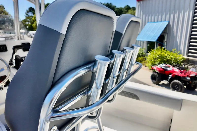 Slide: The Image of 2025 Defiance 240 Catalina boat seats with rod holders, outdoor setting. - 5