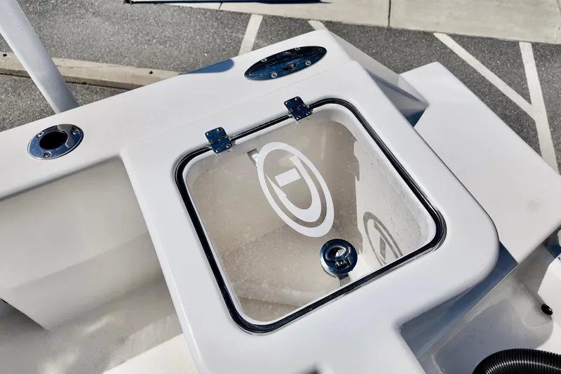 Slide: The Image of 2025 Defiance 240 Catalina boat deck with storage compartment and logo. - 7