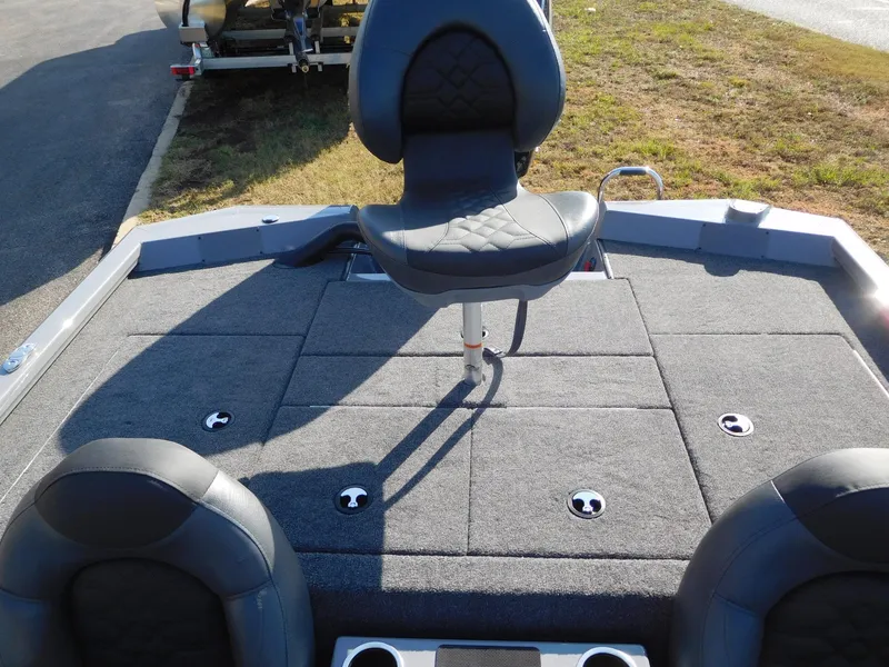 Slide: The Image of 2025 Vexus AVX 1980 boat interior with cushioned seating and storage compartments. - 11