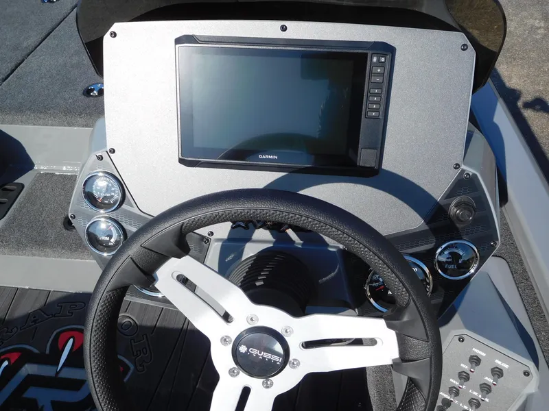 Slide: The Image of 2025 Vexus AVX 1980 boat dashboard with steering wheel and digital display. - 3