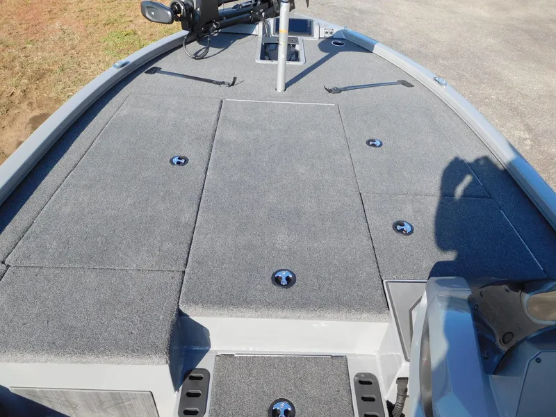 Slide: The Image of 2025 Vexus AVX 1980 boat deck with gray carpeting and storage compartments. - 5