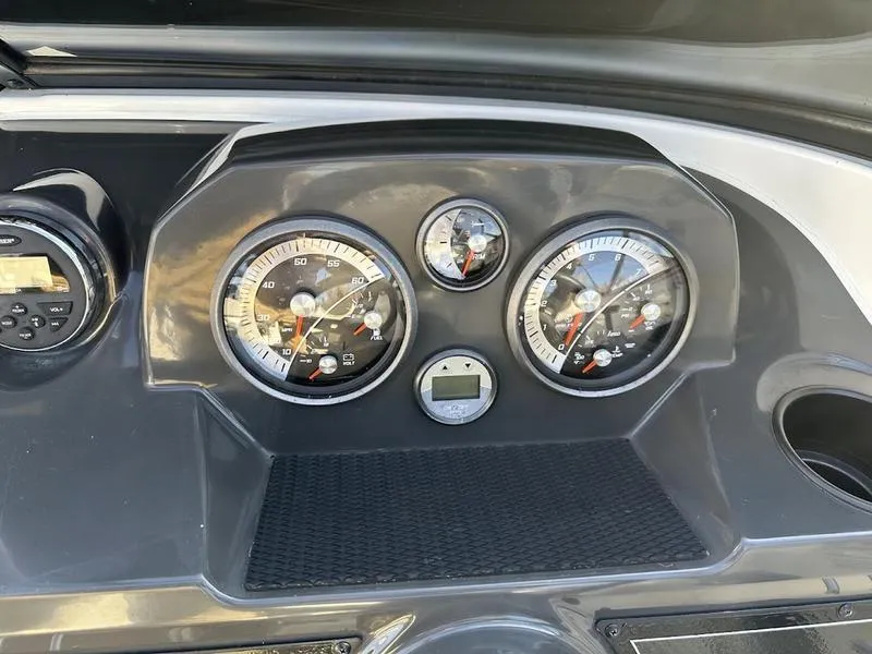 Slide: The Image of Dashboard of 2018 Bayliner VR4 boat with gauges and controls. - 12