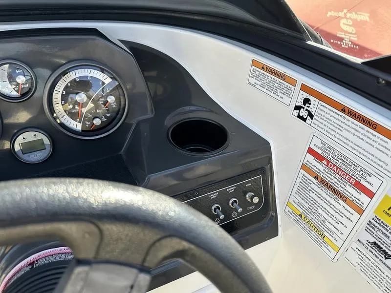 Slide: The Image of Dashboard of 2018 Bayliner VR4 boat with gauges and warning labels. - 9