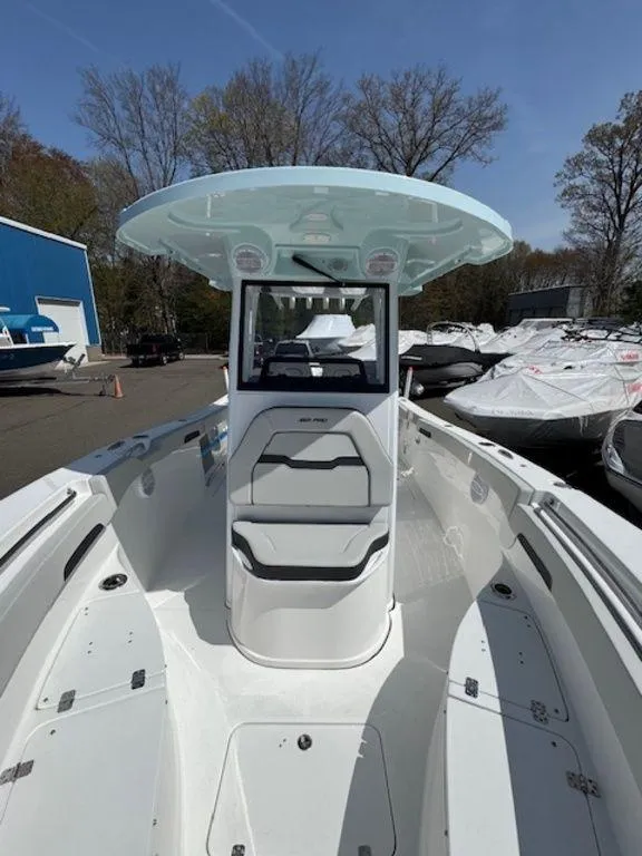 Slide: The Image of 2025 Sea Pro 262 DLX boat with sleek design and spacious deck. - 15