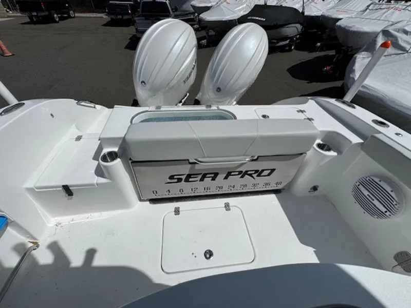 Slide: The Image of 2025 Sea Pro 262 DLX boat with dual engines, spacious deck, and modern design. - 16