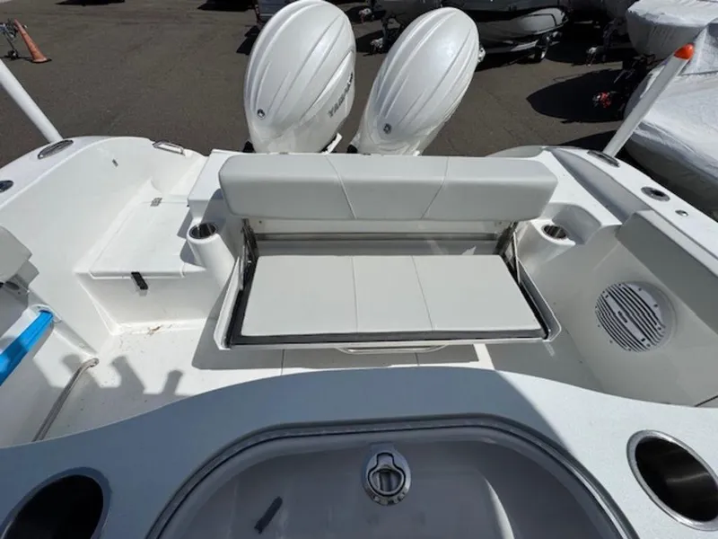 Slide: The Image of 2025 Sea Pro 262 DLX boat with dual engines and spacious seating area. - 19