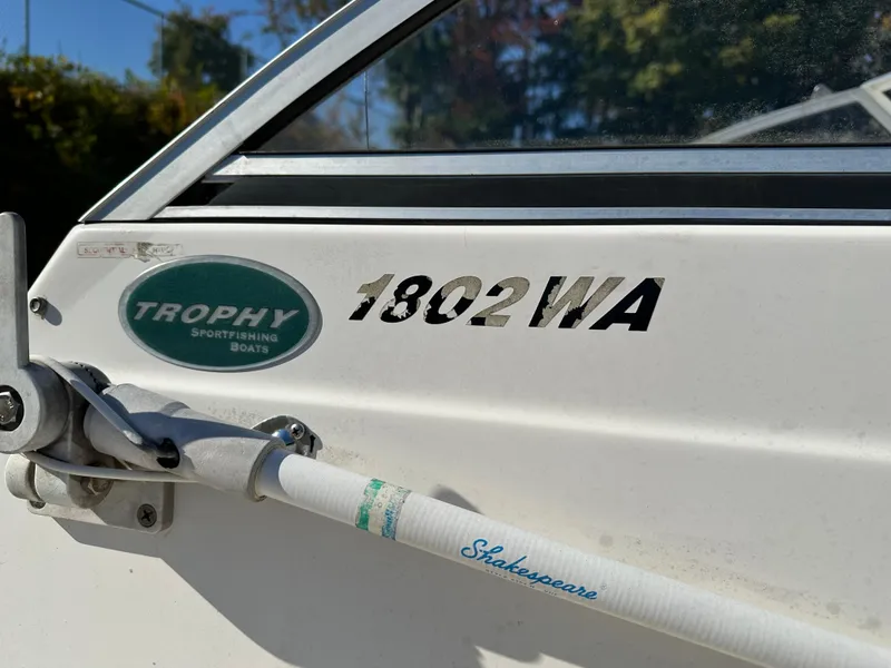 Slide: The Image of Close-up of 2006 Trophy 1802 WA sportfishing boat logo and Shakespeare rod holder. - 10