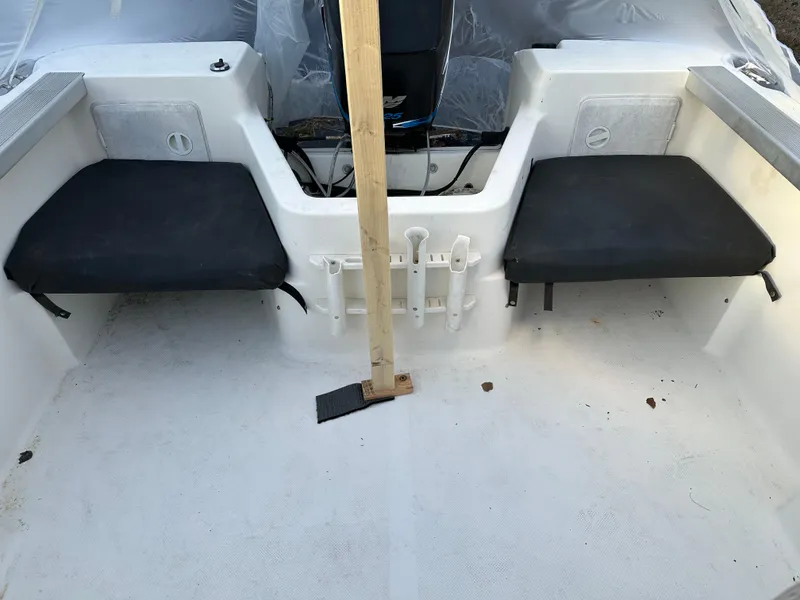 Slide: The Image of 2006 Trophy 1802 WA boat interior with seating and motor. - 13