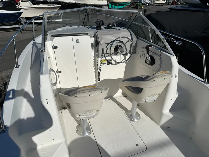 Slide: The Image of 2006 Trophy 1802 WA boat interior with steering wheel and seats. - 6