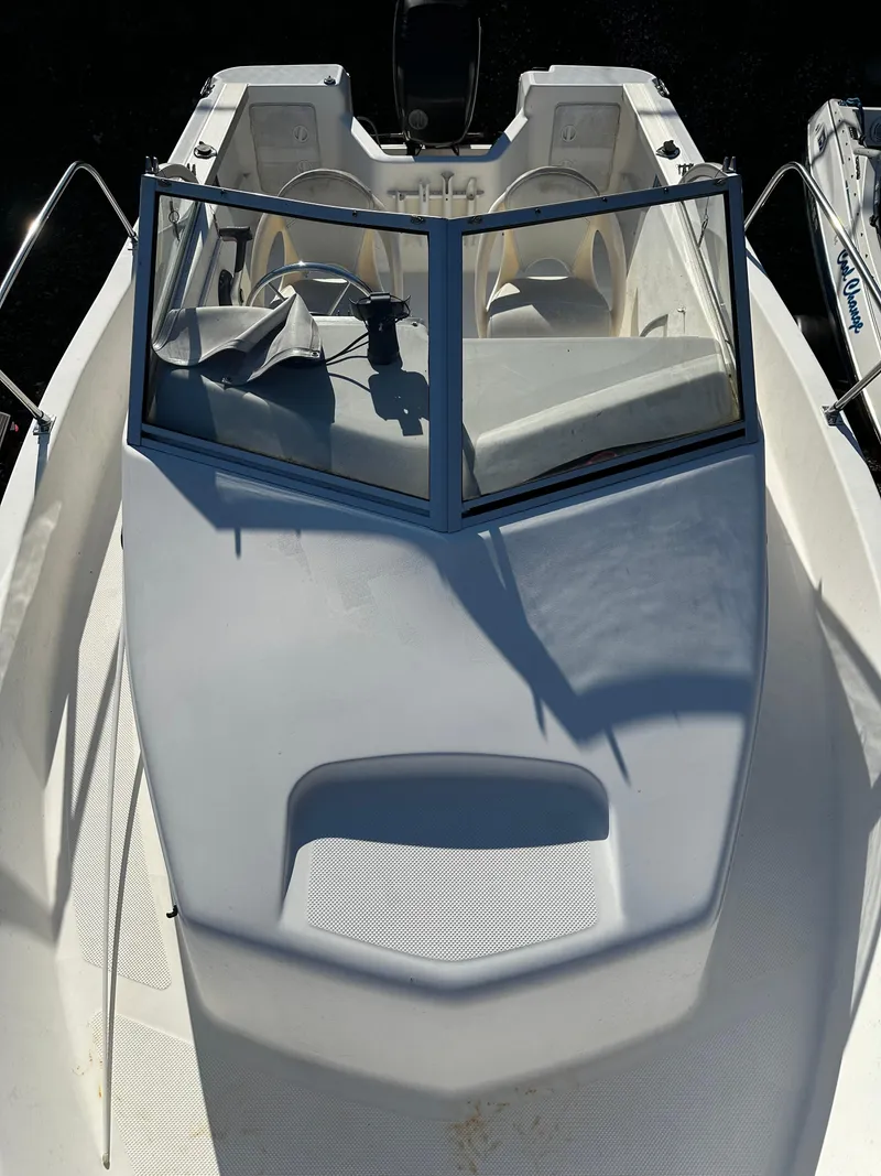 Slide: The Image of 2006 Trophy 1802 WA boat with white deck and windshield, viewed from above. - 9