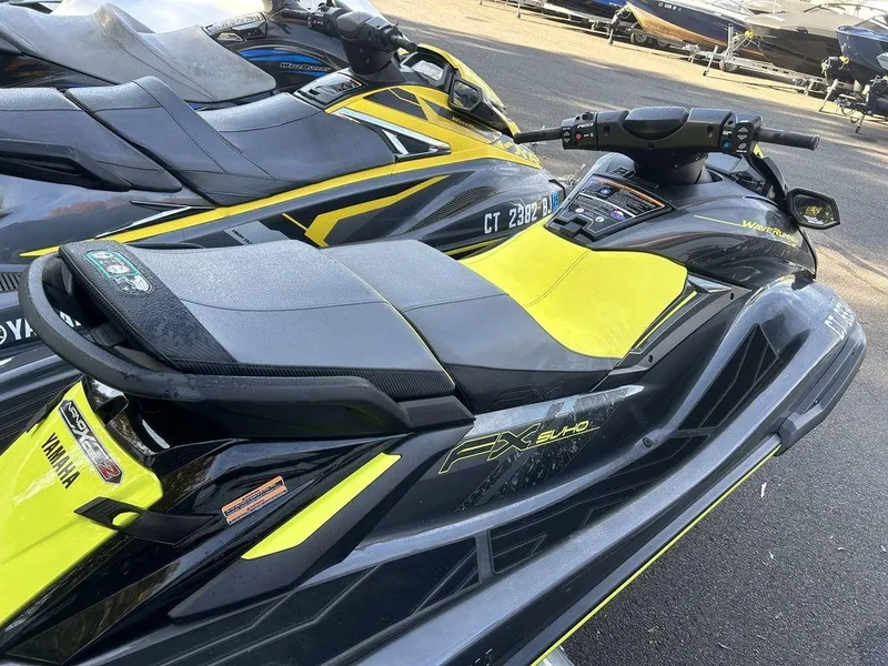 Slide: The Image of 2025 Yamaha WaveRunner FX SVHO jet ski, sleek design, vibrant yellow and black colors. - 6