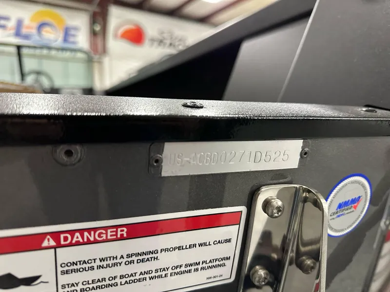 Slide: The Image of 2025 Alumacraft Competitor 205X Sport boat with warning label and identification plate. - 22
