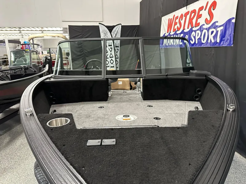 Slide: The Image of 2025 Alumacraft Competitor 205X Sport boat interior at Westre's Marine and Sport showroom. - 5