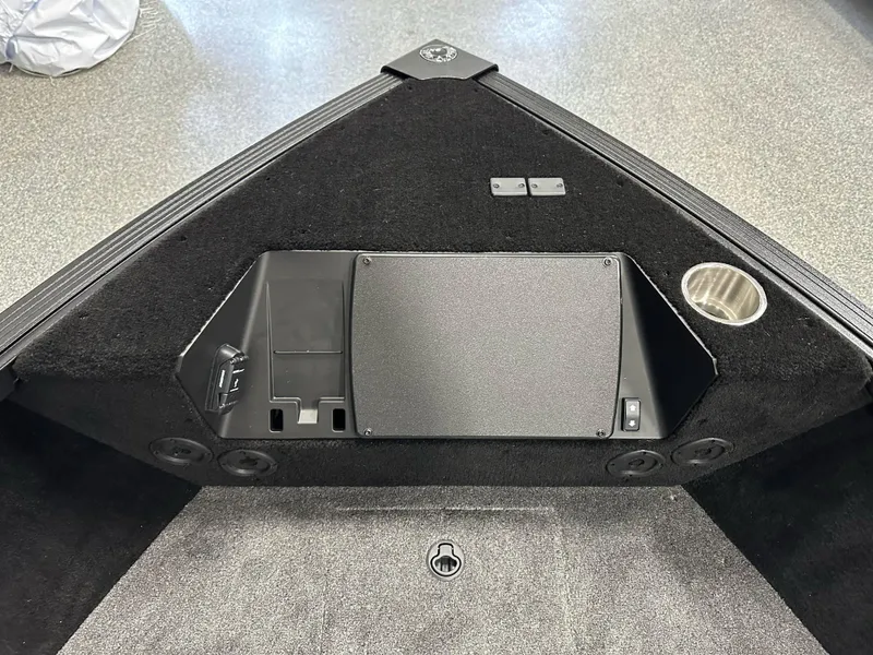 Slide: The Image of 2025 Alumacraft Competitor 205X Sport boat interior, featuring storage compartment and cup holder. - 8