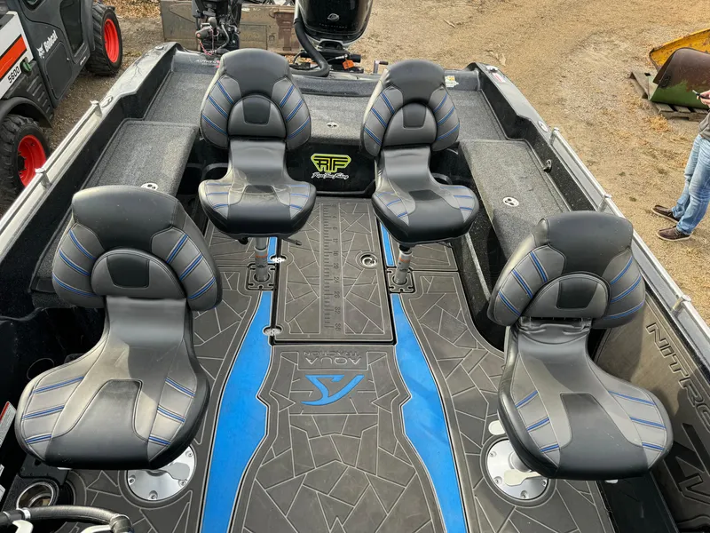 Slide: The Image of 2022 Nitro ZV21 boat interior with four cushioned seats and stylish blue accents. - 12