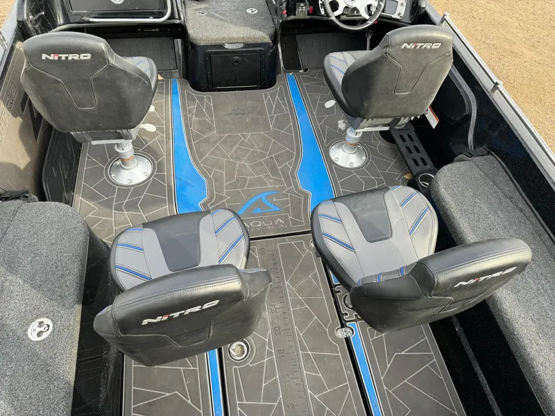Slide: The Image of 2022 Nitro ZV21 boat interior with four seats and stylish flooring design. - 15