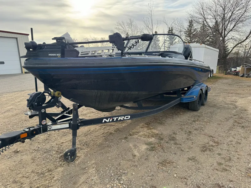 Slide: The Image of 2022 Nitro ZV21 boat on trailer, parked outdoors, overcast sky. - 4
