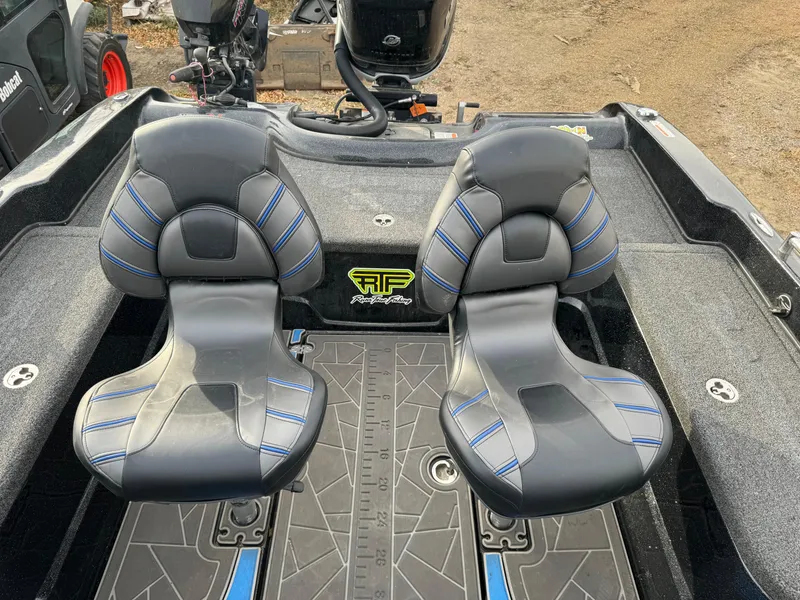 Slide: The Image of 2022 Nitro ZV21 boat seats with blue accents and textured flooring. - 5