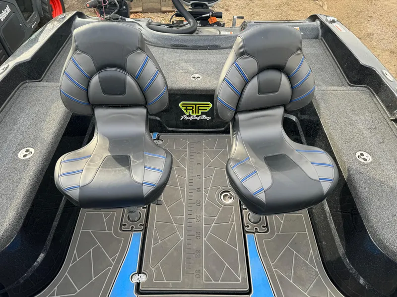 Slide: The Image of 2022 Nitro ZV21 boat interior with dual black and blue seats. - 6