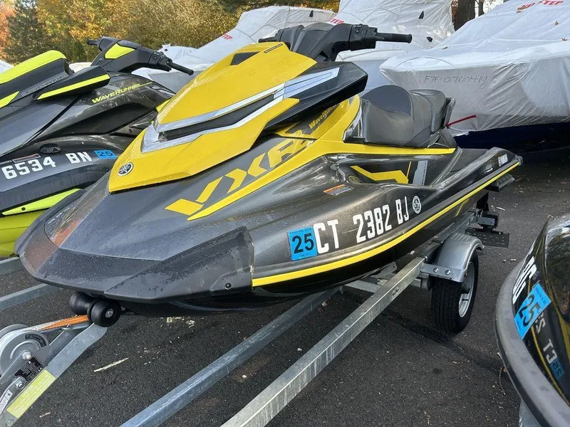 Slide: The Image of 2016 Yamaha WaveRunner VXR® on trailer, yellow and black design, parked outdoors. - 1