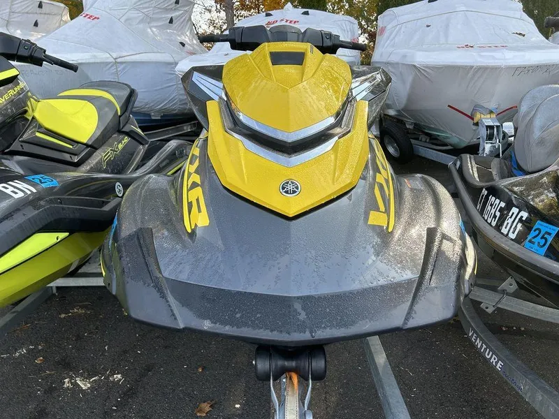 Slide: The Image of 2016 Yamaha WaveRunner VXR® in yellow and gray, parked among other jet skis. - 3